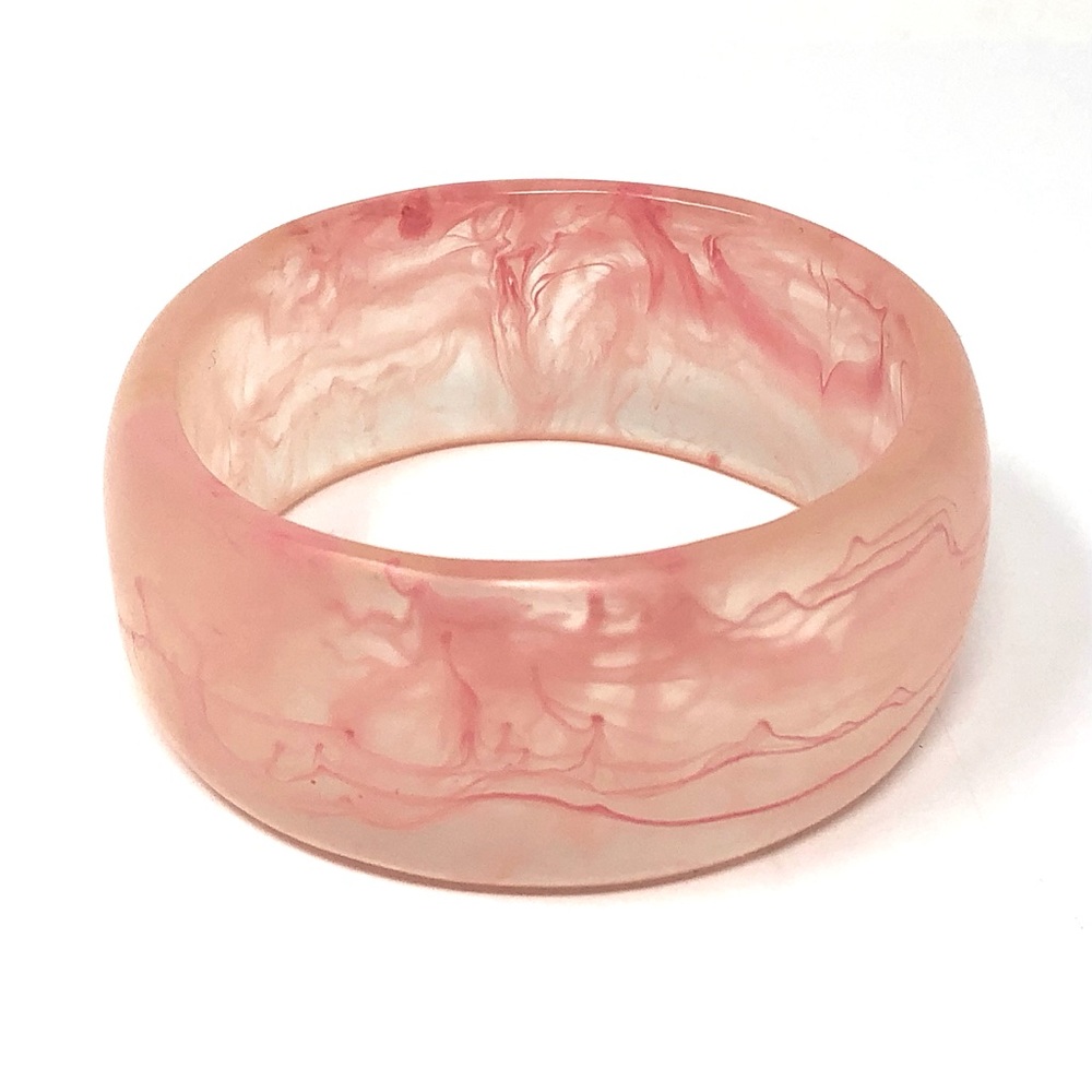 Acrylic pink bangle bracelet with swirl designs